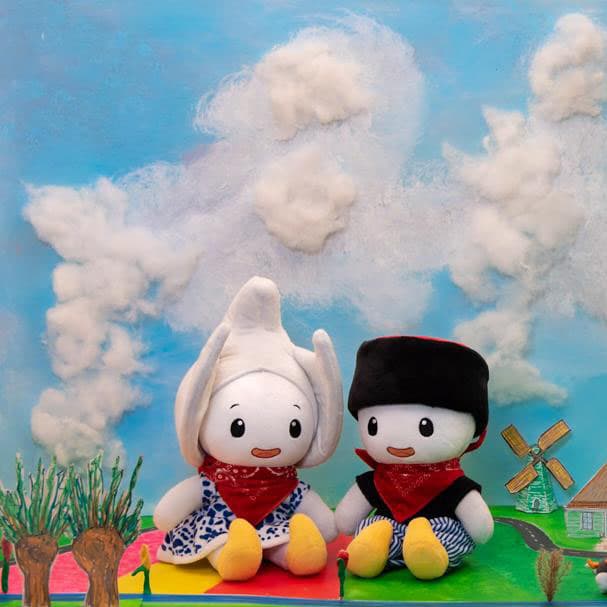 Femke and viktor dolls sitting in their landscape